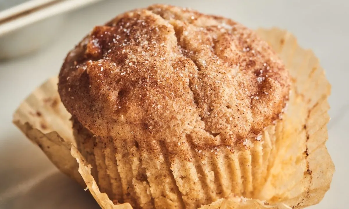 These tender muffins are studded with chunks of apple and showered with cinnamon-sugar. (Joe Lingeman/TNS)