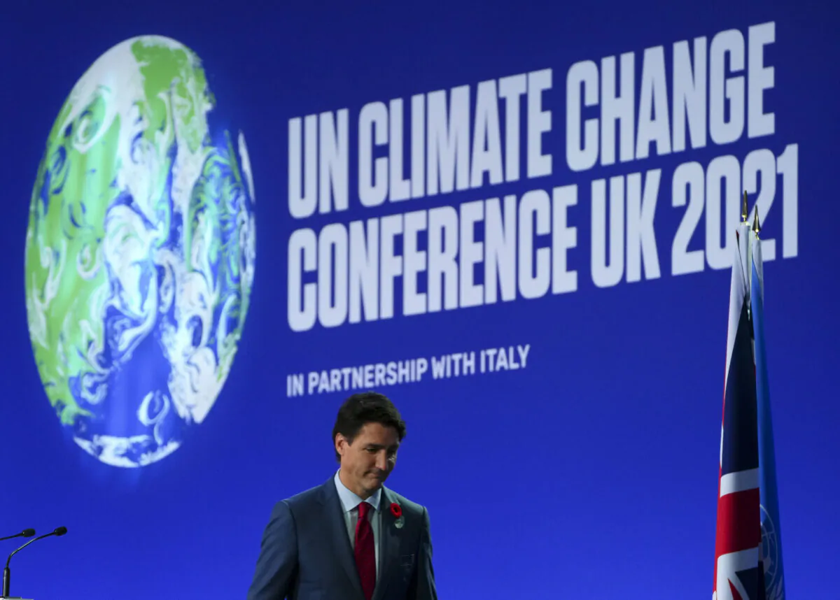 Prime Minister Justin Trudeau leaves the stage after he delivered a short speech at at the 26th meeting of the Council of Parties to the UN climate convention, known as COP26, in Glasgow, Scotland, on Nov. 1, 2021. (The Canadian Press/Sean Kilpatrick)