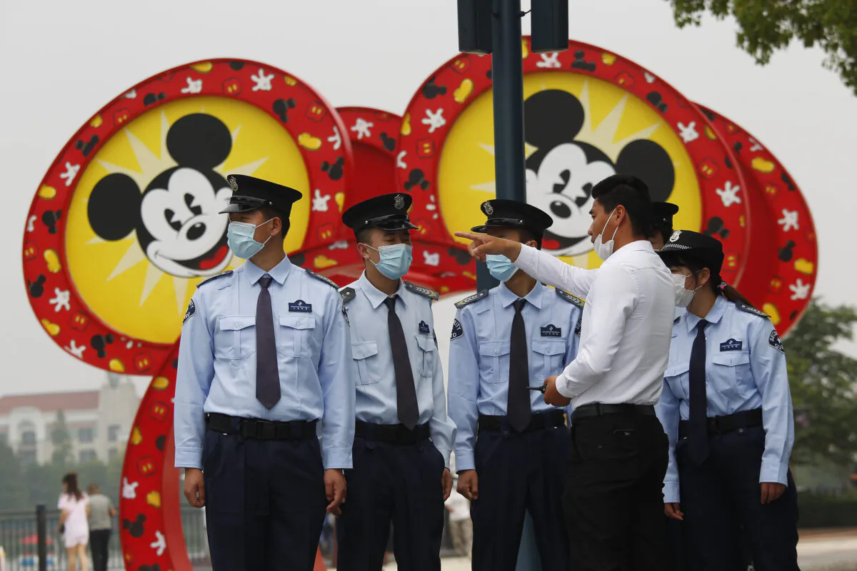Security guards at Shanghai Disneyland after its reopening in Shanghai, China on May 11, 2020.  (Hu Chengwei/Getty Images)