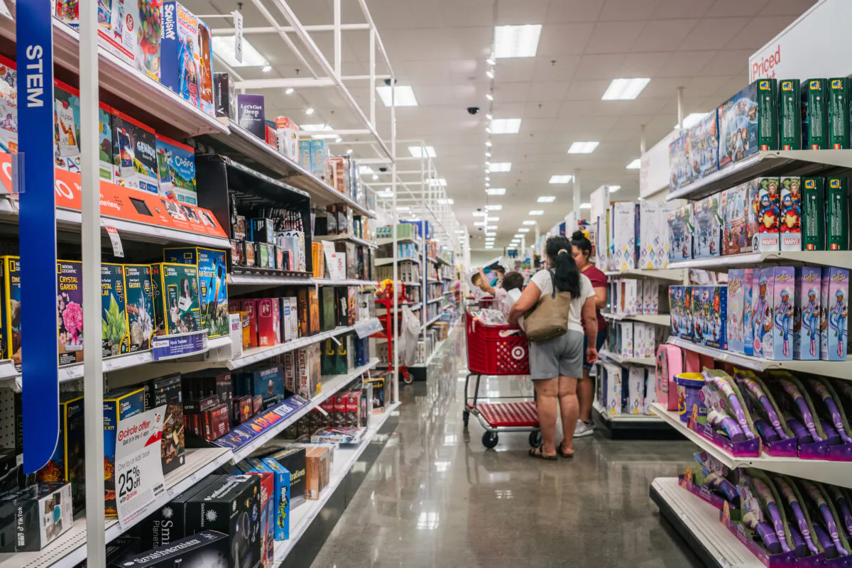 A family shops for toys at a Target store in Houston, Texas, on Oct. 25, 2021. (Brandon Bell/Getty Images)