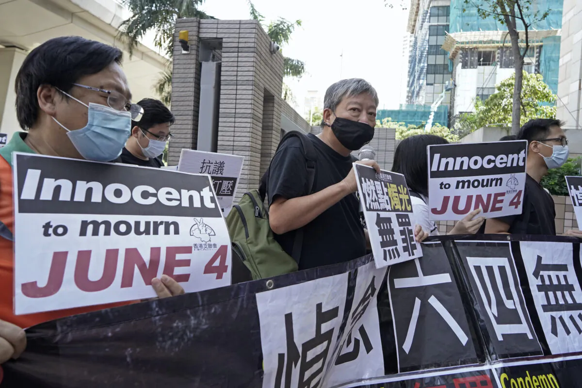Pro-democracy activists, including Lee Cheuk-Yan (C), arrive at a court in Hong Kong on Oct. 15, 2020. (Kin Cheung/AP Photo)