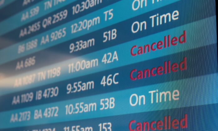 A screen showing canceled flights at Los Angeles International Airport on Oct. 31, 2021. (Carlos Barria/Reuters)