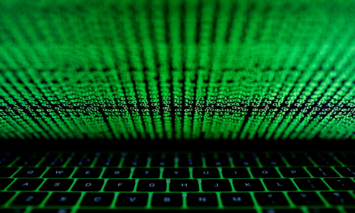 A computer keyboard lit by a displayed cyber code is seen in this illustration picture taken on March 1,  2017. (Kacper Pempel/Reuters)