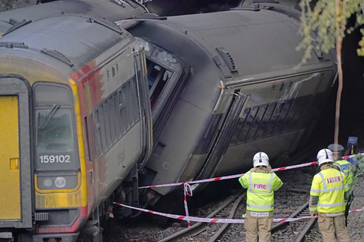 Firefighters at the scene of a crash involving two trains in Salisbury on Oct. 31, 2021. (Steve Parsons/PA)