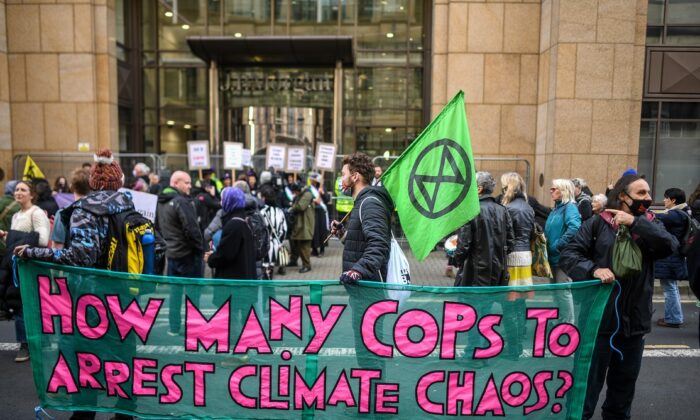 Extinction Rebellion protesters are seen during a demo outside JP Morgan in Glasgow, United Kingdom, on Nov. 2, 2021. (Peter Summers/Getty Images)