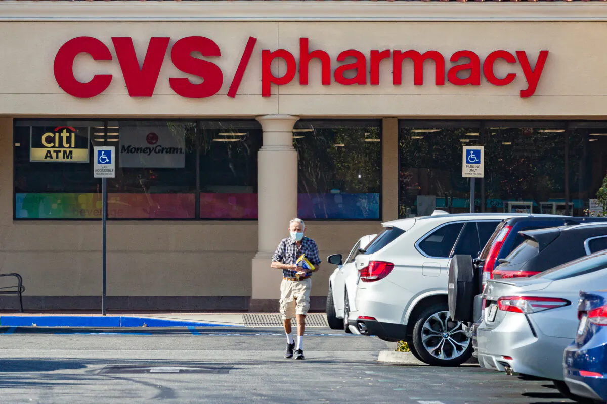 An elderly customer leaves a CVS Pharmacy in Irvine, California, on Feb. 11, 2021. (John Fredricks/The Epoch Times)