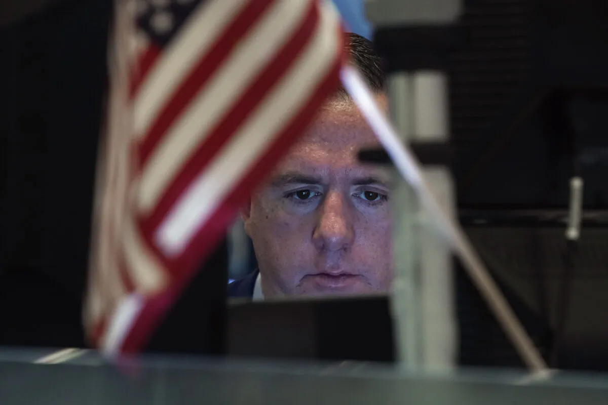 Trader Justin Flinn works on the floor of the New York Stock Exchange on Tue. Nov. 2, 2021. (Richard Drew/AP Photo)