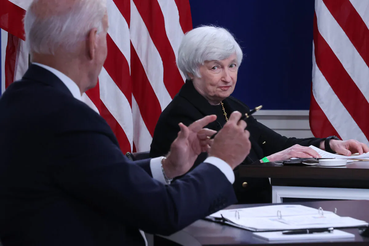 U.S. Treasury Secretary Janet Yellen (C) listens to President Joe Biden during a hybrid meeting with corporate chief executives and members of his cabinet to discuss the looming federal debt limit in the South Court Auditorium in the Eisenhower Executive Office Building in Washington on Oct. 6, 2021. (Chip Somodevilla/Getty Images)