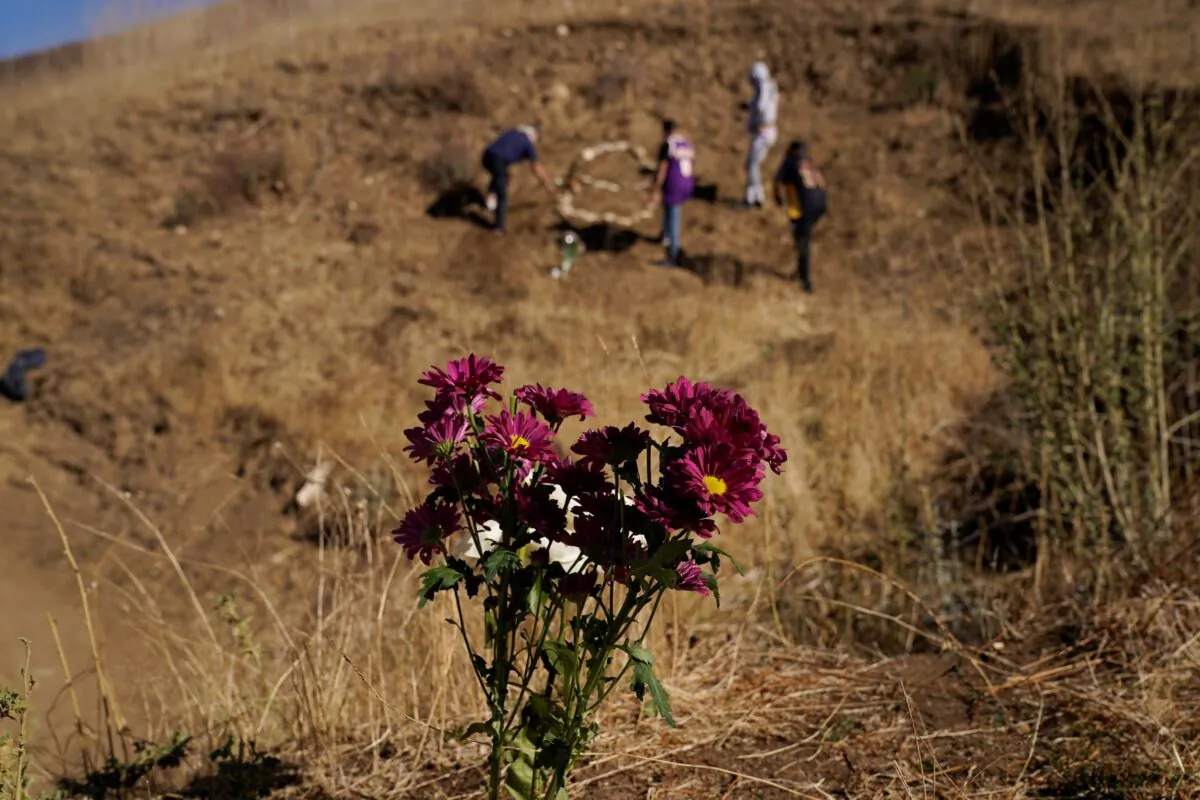 A file photo of flowers placed in honor of Kobe Bryant at the site of a helicopter crash that killed Bryant, his daughter Gianna, and seven others one year ago on Jan. 26, 2021. (Marcio Jose Sanchez/AP Photo)