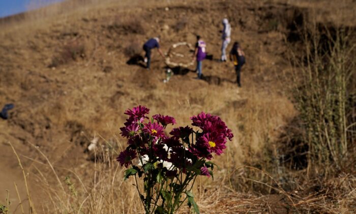 A file photo of flowers placed in honor of Kobe Bryant at the site of a helicopter crash that killed Bryant, his daughter Gianna, and seven others one year ago on Jan. 26, 2021. (Marcio Jose Sanchez/AP Photo)