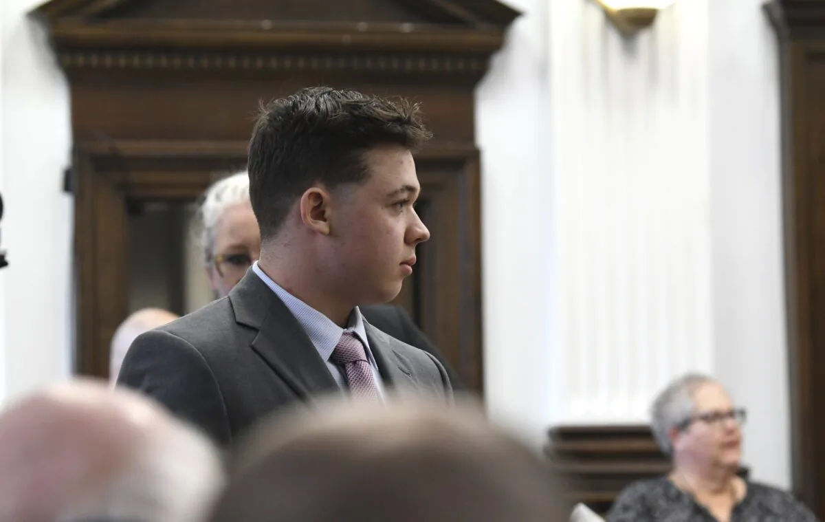 Kyle Rittenhouse  walks into court for the start of jury selection on the first day of his trial in Kenosha, Wis., Circuit Court, on Nov. 1, 2021. (Mark Hertzberg/Pool Photo via AP)