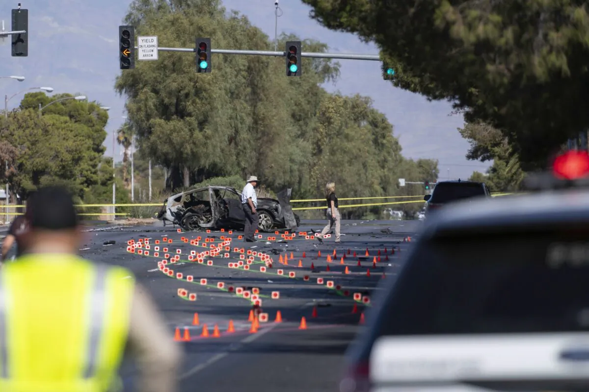 Las Vegas Metro Police investigators work at the scene of a fatal crash in Las Vegas, on Nov. 2, 2021. (Eric Jamison/AP Photo)