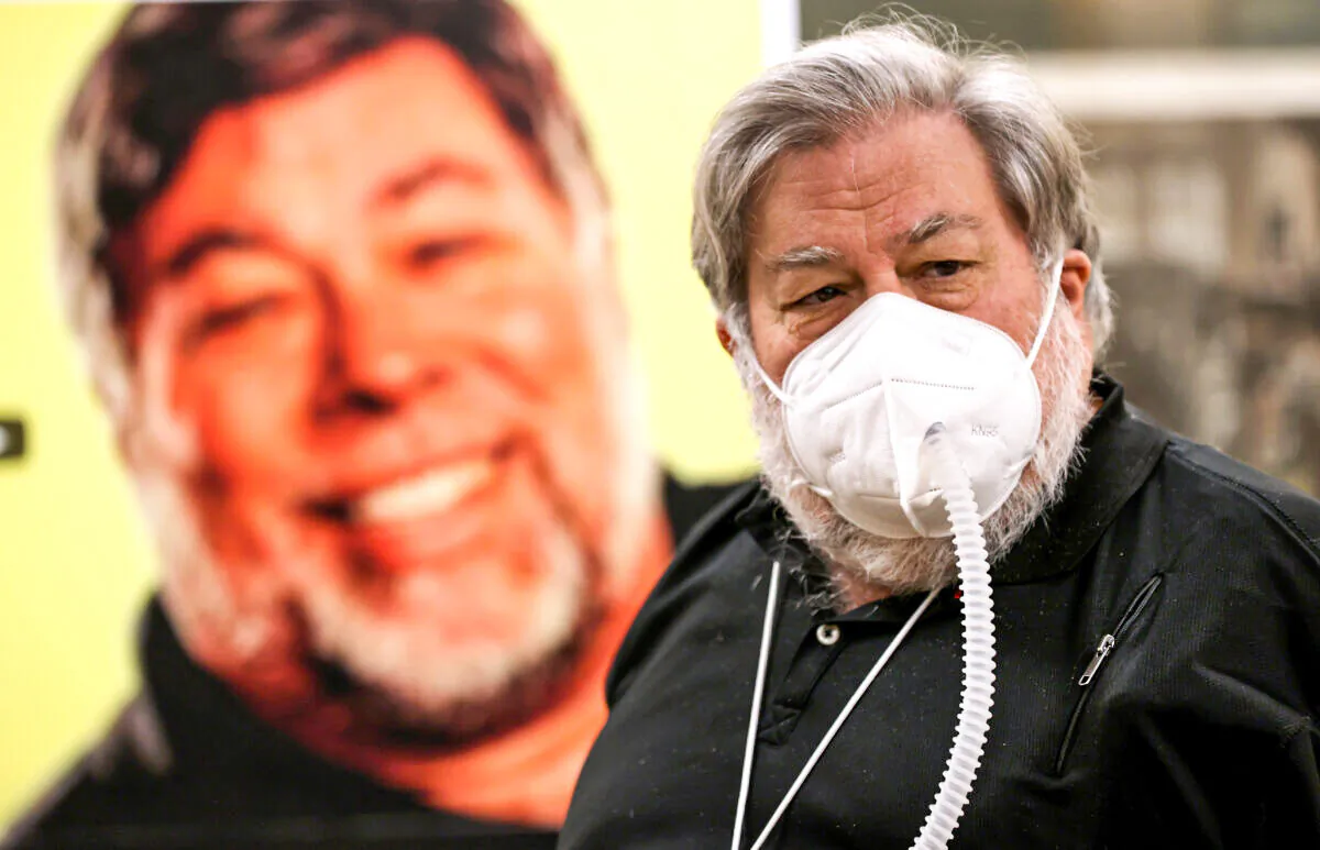 Apple co-founder Steve Wozniak wears a protective mask as he stands next to a photo of himself during a press conference on July 23, 2020 in Burlingame, California. (Justin Sullivan/Getty Images)