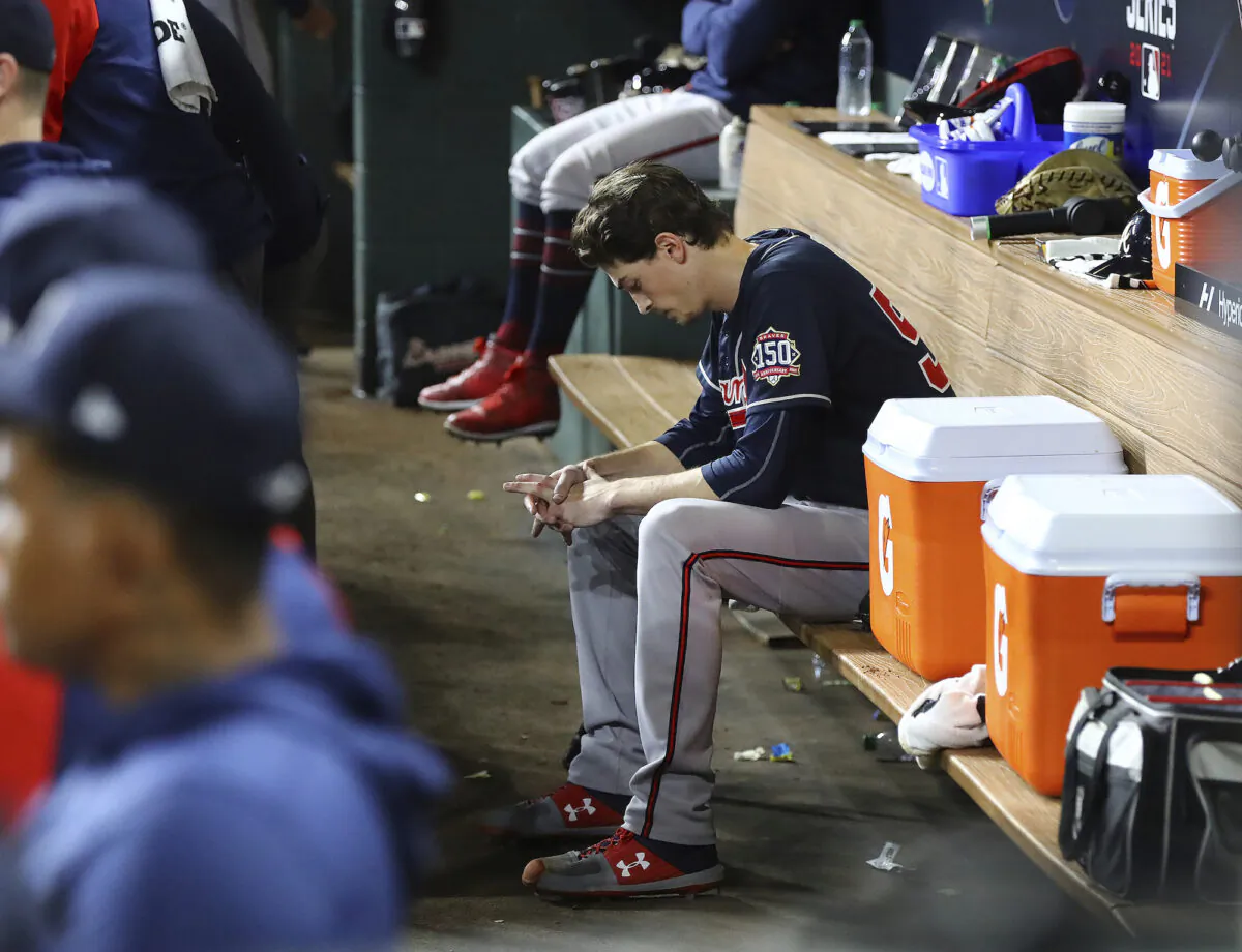 Braves starter Max Fried sits dejected in the dugout during the 6th inning of a 7–2 loss to the Astros in game 2 of the World Series in Houston on Oct. 27, 2021. (Curtis Compton/Atlanta Journal-Constitution via AP)