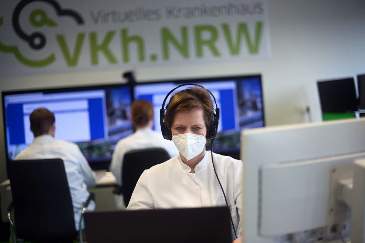 Sandra Dohmen, senior physician at the University hospital in Aachen, uses telemedicine for the treatment of COVID-19 patients, in Aachen, western Germany, on Jan. 20, 2021. (Ina Fassbender/AFP via Getty Images)