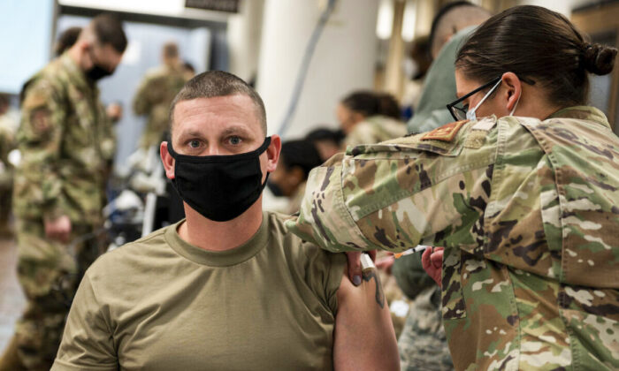 A U.S. Air Force member receives a COVID-19 vaccine at Osan Air Base, Republic of Korea, on Dec. 29, 2020. (U.S. Air Force photo by Staff Sgt. Betty R. Chevalier via Getty Images)