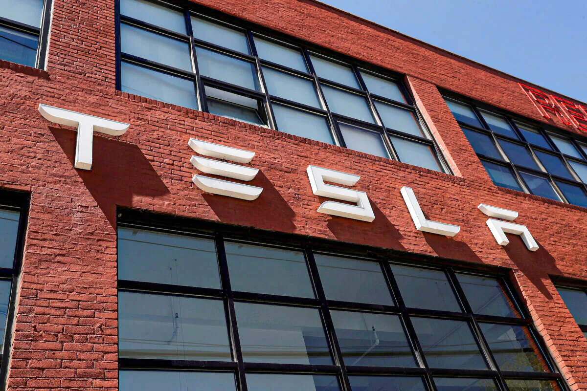 The Tesla logo is seen outside a dealership in the Brooklyn borough of New York on April 26, 2021. (Shannon Stapleton/Reuters)