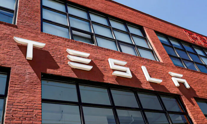 The Tesla logo is seen outside a dealership in the Brooklyn borough of New York on April 26, 2021. (Shannon Stapleton/Reuters)