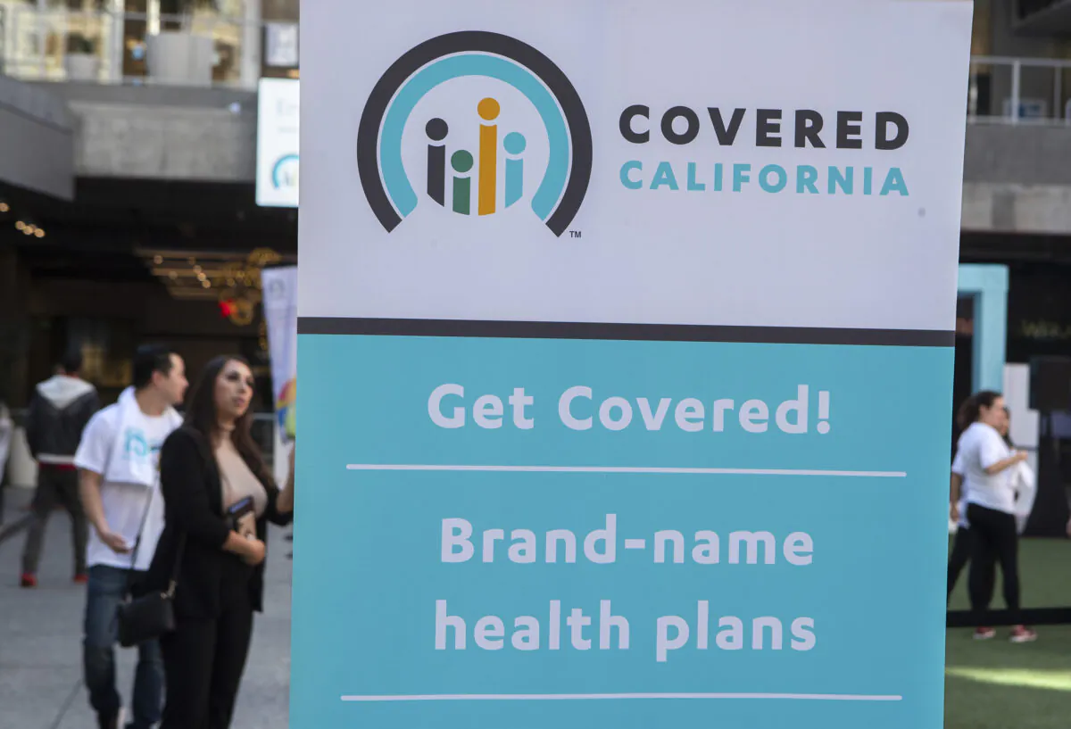 A banner promoting state marketplace Covered California is displayed during a Covered California Open Enrollment Kickoff Event at The Bloc in downtown Los Angeles on Nov. 4, 2019. (Mel Melcon/Los Angeles Times/TNS)