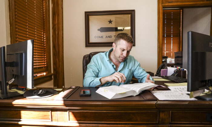 Kinney County Attorney Brent Smith in his office in Brackettville, Texas, on Oct. 29, 2021. (Charlotte Cuthbertson/The Epoch Times)