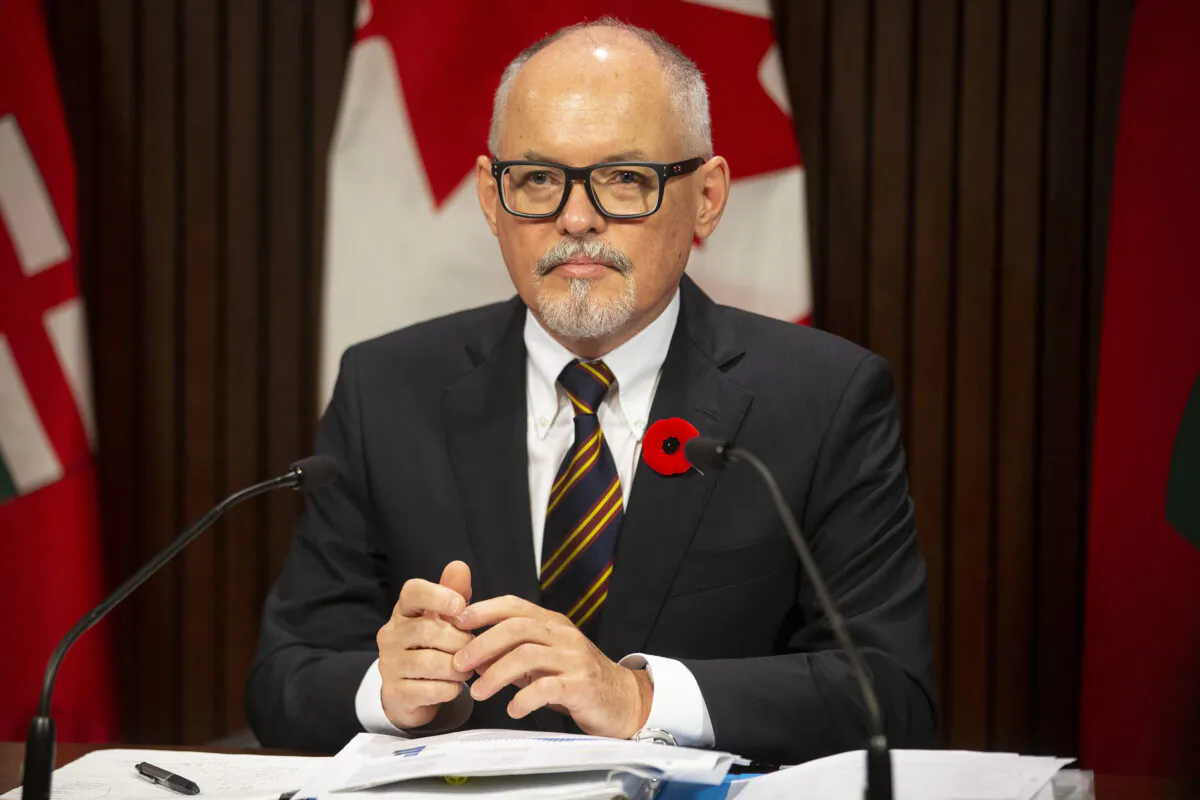 Ontario's Chief Medical Officer Dr. Kieran Moore attends a press briefing at Queen's Park in Toronto on Nov. 3, 2021. The province announced that it is planning to offer booster doses of COVID-19 vaccines to all Ontarians, starting with the next priority group who will be able to book appointments starting Nov. 6. (The Canadian Press/Chris Young)