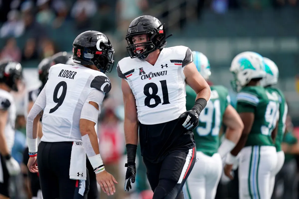Cincinnati tight end Josh Whyle (81) celebrates his touchdown reception with quarterback Desmond Ridder (9) during the first half of an NCAA college football game against Tulane in New Orleans, on Oct. 30, 2021. (Gerald Herbert/AP Photo)