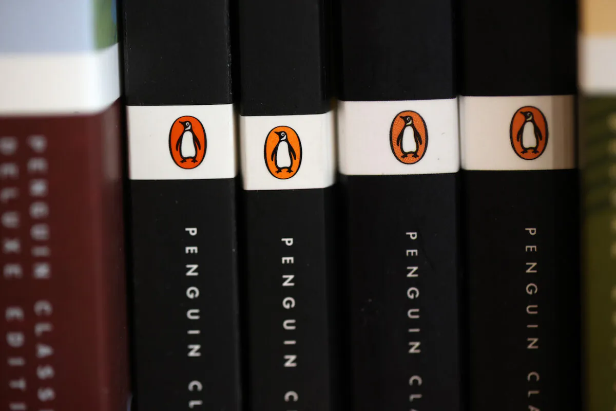 The Penguin logo is visible on the spines of books displayed on a shelf at Book Passage in Corte Madera, Calif., on Nov. 2, 2021. (Justin Sullivan/Getty Images)