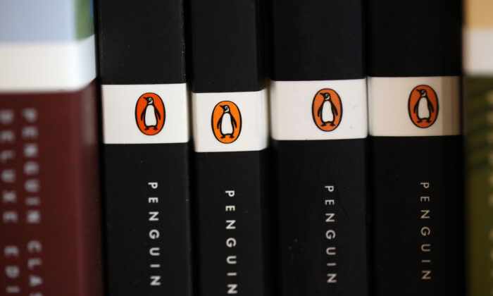 The Penguin logo is visible on the spines of books displayed on a shelf at Book Passage in Corte Madera, Calif., on Nov. 2, 2021. (Justin Sullivan/Getty Images)