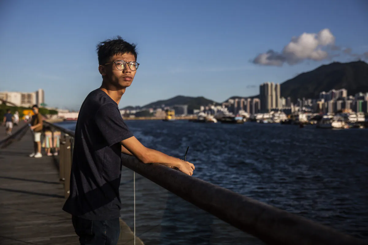 Teenage democracy activist Chung, 20, poses near the sea in Hong Kong on Aug. 8, 2020, before he was arrested. (ISAAC LAWRENCE/AFP via Getty Images)