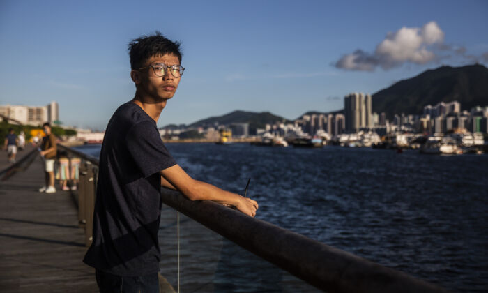 Teenage democracy activist Chung, 20, poses near the sea in Hong Kong on Aug. 8, 2020, before  he was arrested. (ISAAC LAWRENCE/AFP via Getty Images)