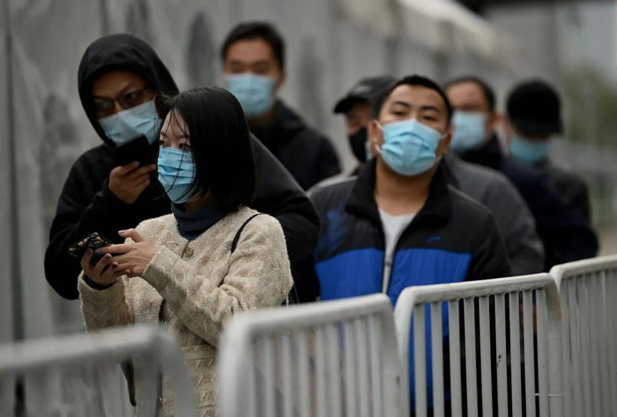 People queue for swab test for COVID-19 in Beijing on Nov.1, 2021. (Noel Celis/AFP via Getty Images)