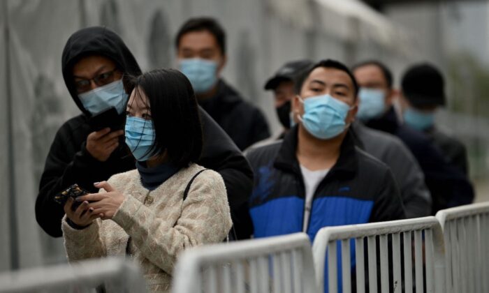 People queue for swab test for COVID-19 in Beijing on Nov.1, 2021. (Noel Celis/AFP via Getty Images)