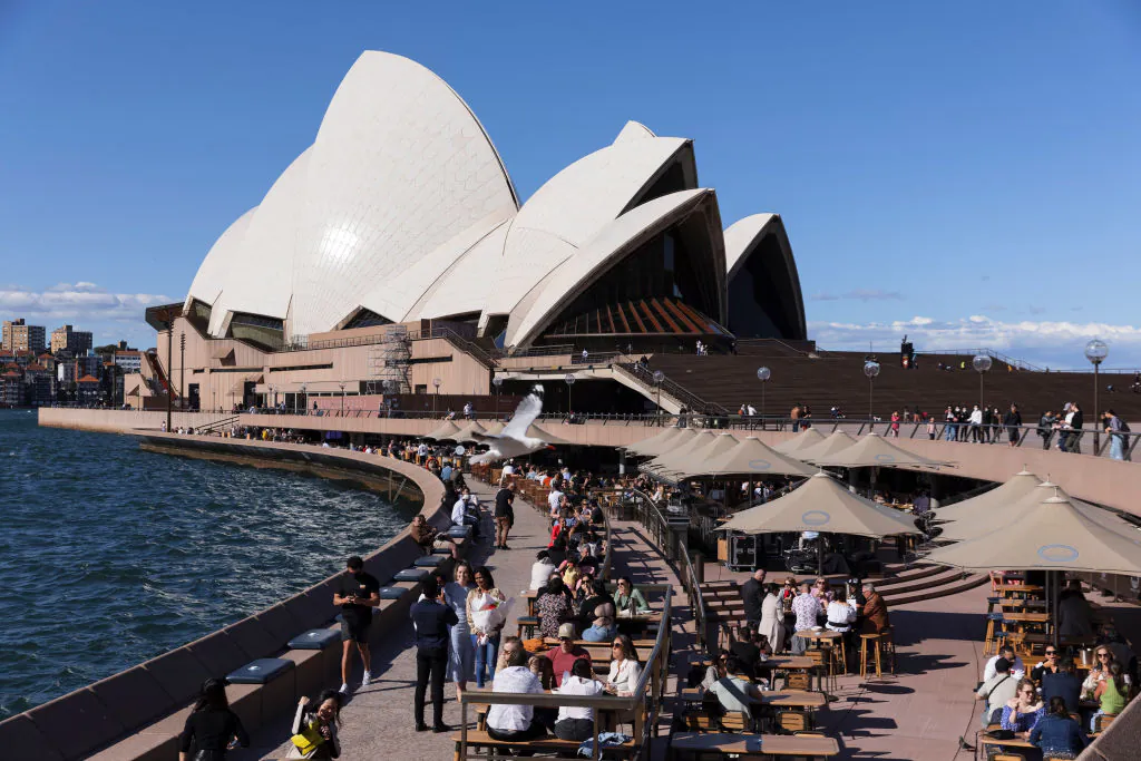 People gather at the Opera Bar as hospitality reopens in Sydney, Australia, on Oct. 16, 2021. (Brook Mitchell/Getty Images)