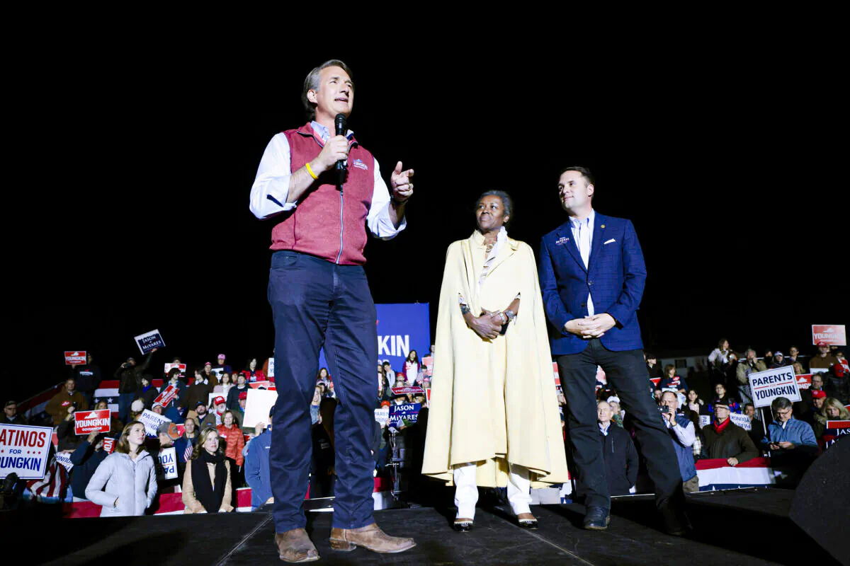 Virginia Republican candidate for Lieutenant Governor Winsome Sears and Virginia Republican Attorney General candidate Jason Miyares look on as Virginia Republican gubernatorial candidate Glenn Youngkin speaks at a campaign rally at the Loudon County Fairground in Leesburg, Va., on Nov. 1, 2021. (Anna Moneymaker/Getty Images)