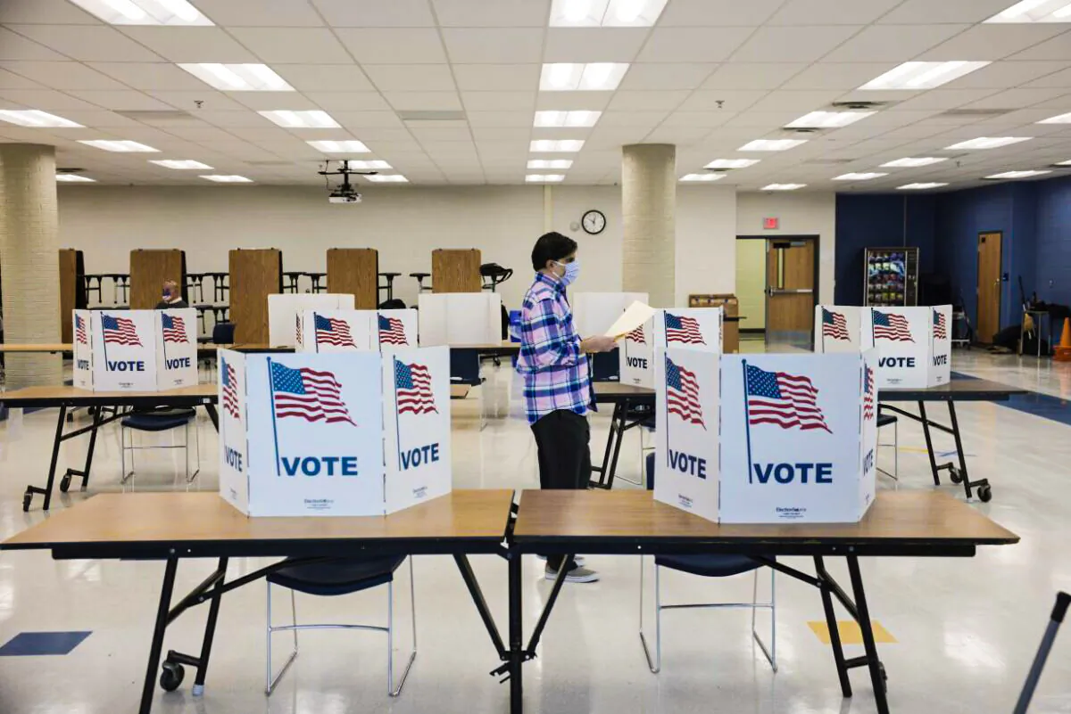 Virginia residents vote at a voting location in the Rocky Run Middle School in Chantilly, Va., on Nov. 2, 2021. (Anna Moneymaker/Getty Images)