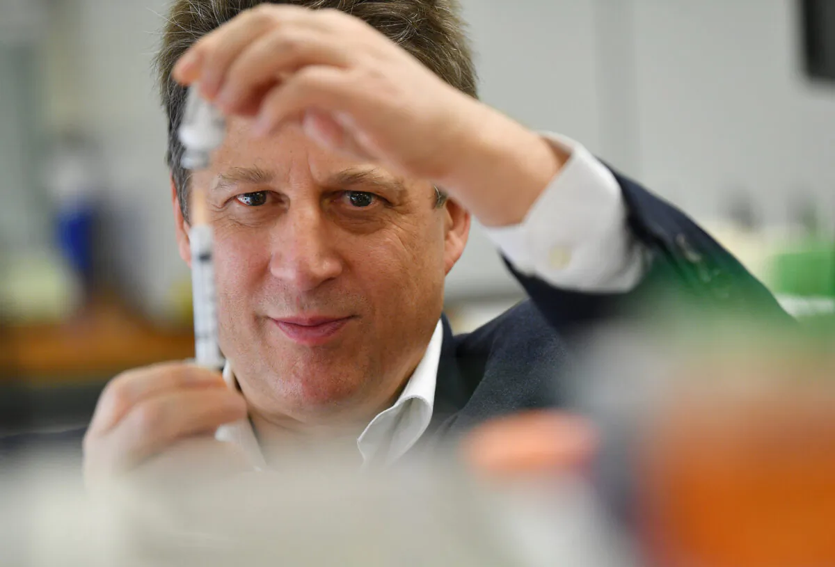 Vaxine research director Nikolai Petrovsky in the Flinders University lab in Adelaide, South Australia, with a vaccine specimen, on July 2, 2020. (David Mariuz/AAP Image)