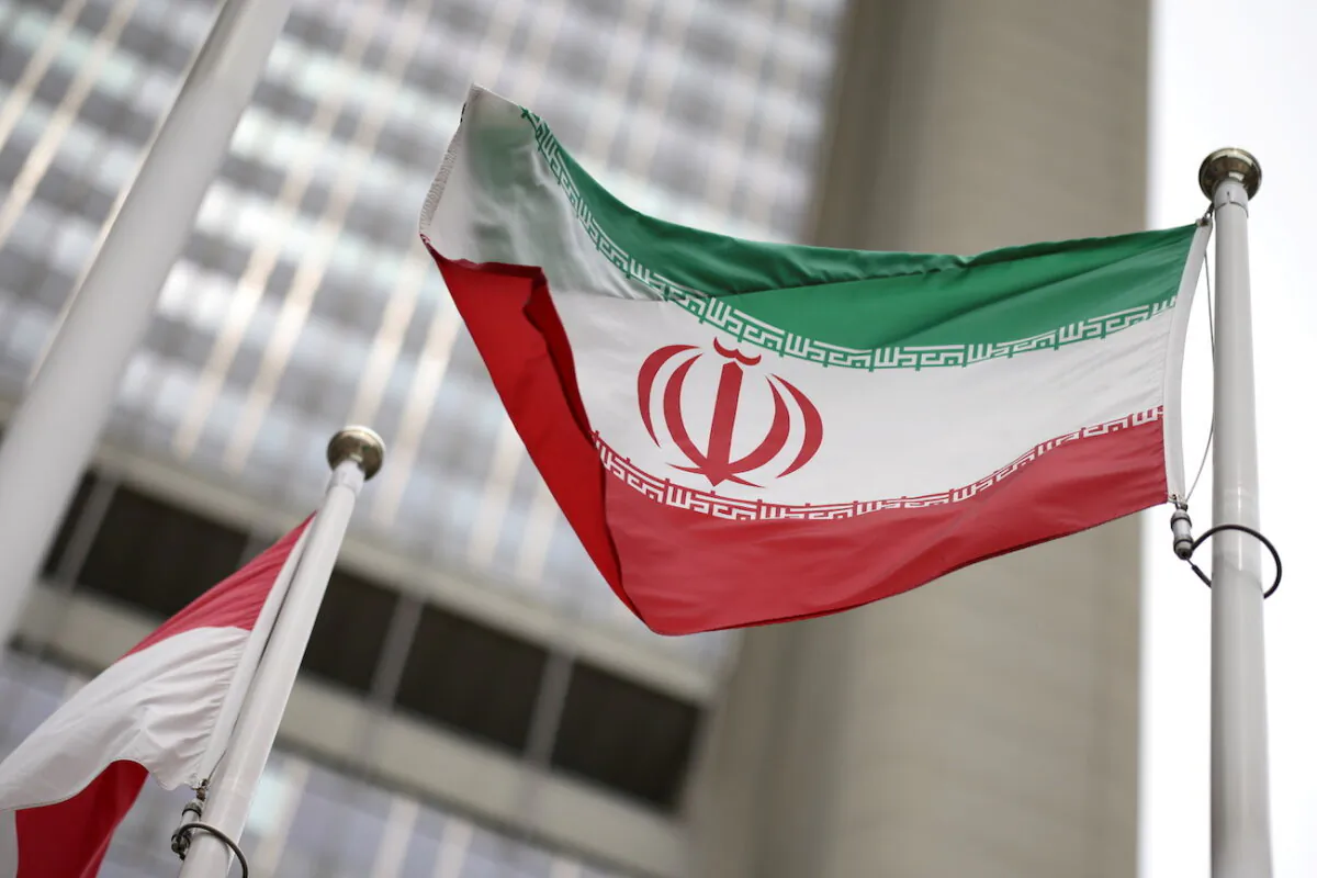 The Iranian flag flies in front of the United Nations’ International Atomic Energy Agency in Vienna on May 24, 2021. (Lisi Niesner/Reuters)