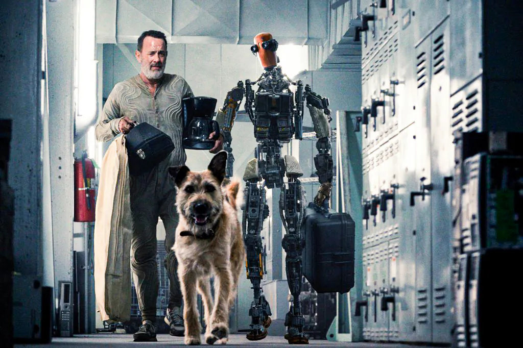 (L–R) Finch, Goodyear and Jeff (voiced by Caleb Landry Jones)  in “Finch.” (Columbia Pictures)