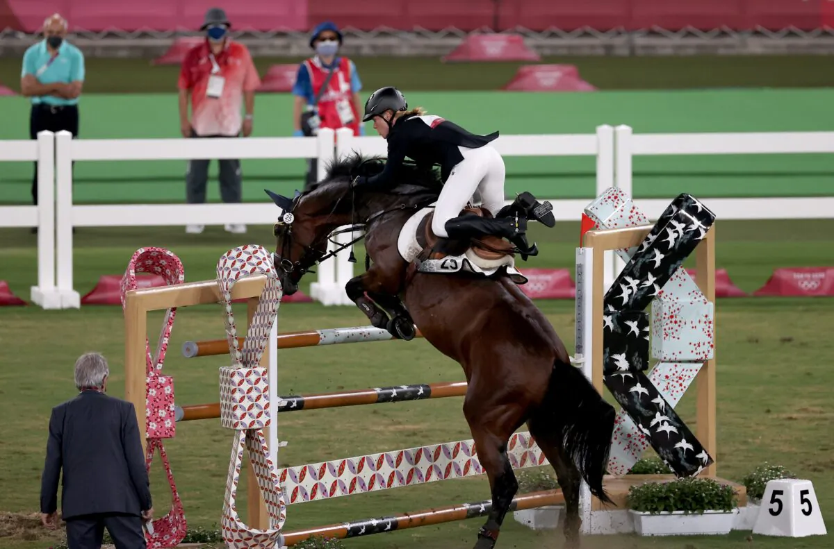 Annika Schleu of Germany in action in the women's individual riding show jumping modern pentathlon at the Tokyo 2020 Olympic Games in Tokyo, Japan, on Aug. 6, 2021. (Ivan Alvarado/Reuters)
