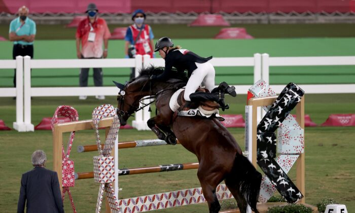 Annika Schleu of Germany in action in the women's individual riding show jumping modern pentathlon at the Tokyo 2020 Olympic Games in Tokyo, Japan, on Aug. 6, 2021. (Ivan Alvarado/Reuters) 