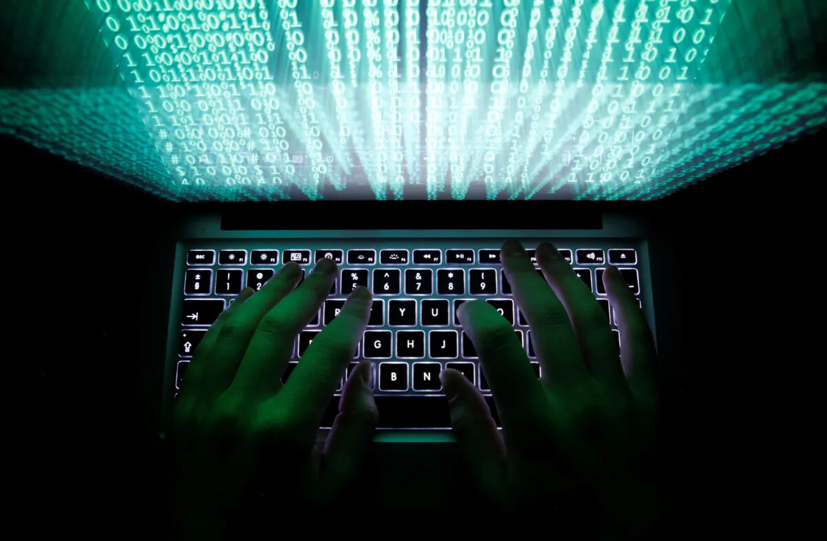 A man types on a computer keyboard in this illustration picture taken on Feb. 28, 2013.  (Kacper Pempel/Reuters)