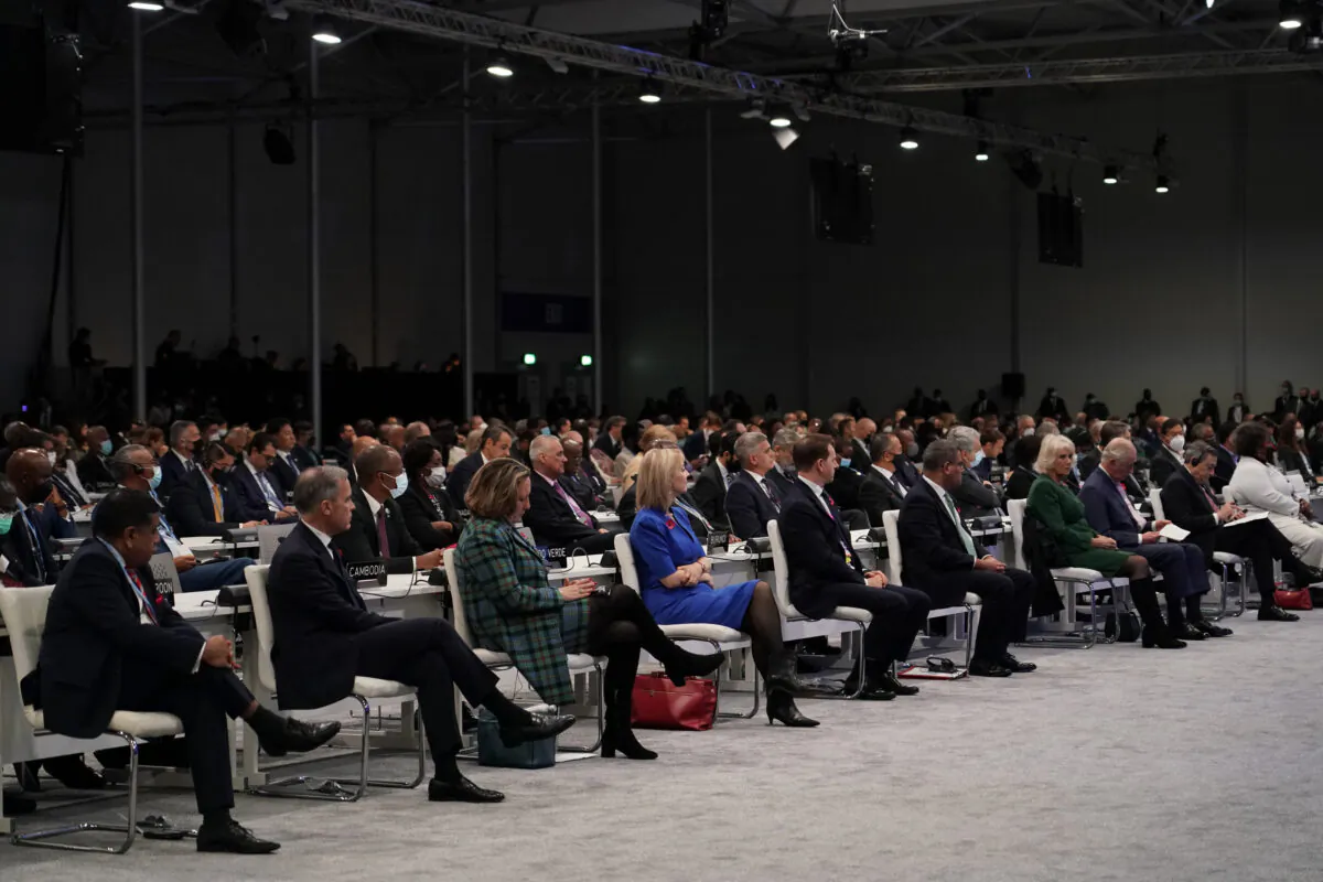 Attendees listen during the opening ceremony of the COP26 U.N. Climate Summit, in Glasgow, Scotland, on Nov. 1, 2021. The U.N. climate summit in Glasgow gathers leaders from around the world, in Scotland's biggest city, to lay out their vision for addressing the common challenge of global warming. (Alberto Pezzali/AP Photo)