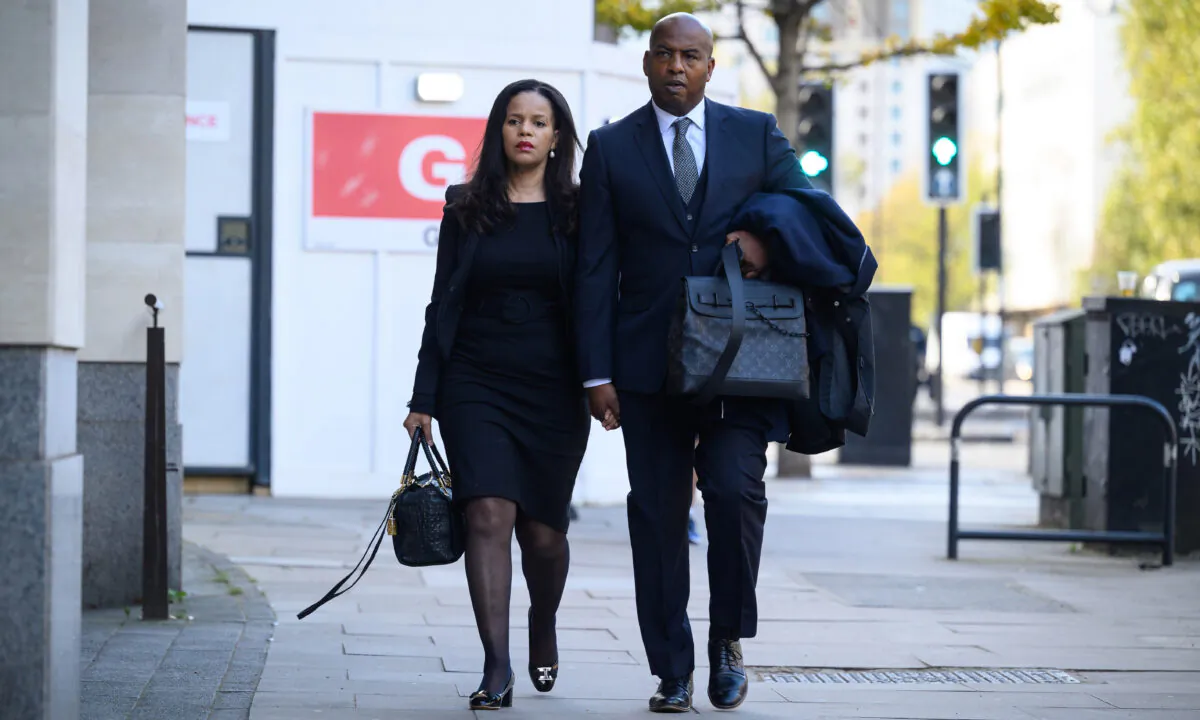 Labour MP Claudia Webbe (L) arrives with her partner Lester Thomas at the City of Westminster Magistrates Court in London on Nov. 4, 2021. (Leon Neal/Getty Images)