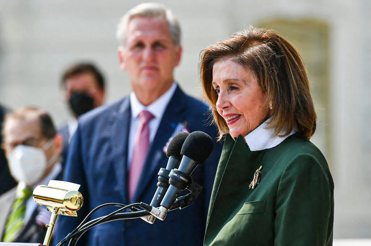 House Speaker Nancy Pelosi (D-Calif.) speaks with House Minority Leader Kevin McCarthy (R-Calif.) and other members of Congress as they take part in a ceremony to commemorate the 20th anniversary of the 9/11 attacks on the steps of the U.S. Capitol in Washington on Sept. 13, 2021. (Mandel Ngan/AFP via Getty Images)