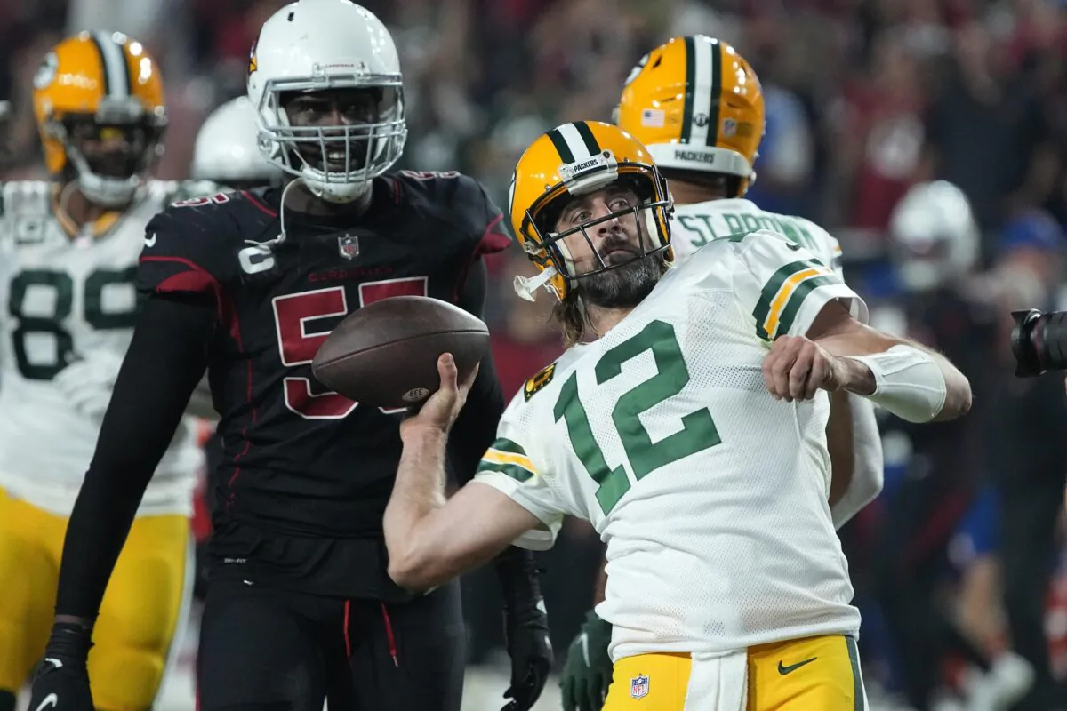 Green Bay Packers quarterback Aaron Rodgers throws the ball into the crowd, as time expires during the second half of an NFL football game against the Arizona Cardinals, in Glendale, Ariz., on Oct. 28, 2021. (Rick Scuteri/AP Photo)