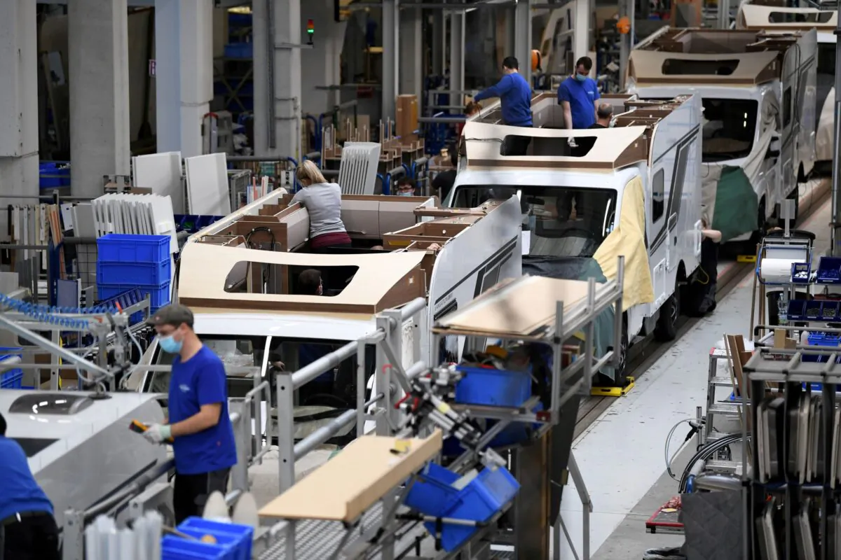 Workers assemble campers at Knaus-Tabbert AG factory in Jandelsbrunn near Passau, Germany on March 16, 2021. (Andreas Gebert/Reuters)