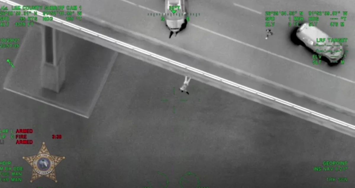 Aerial shot of man jumping off bridge in Fort Myers, Fla., on Oct. 30, 2021. (Lee County Sheriff's Office/AP/Screenshot via NTD)