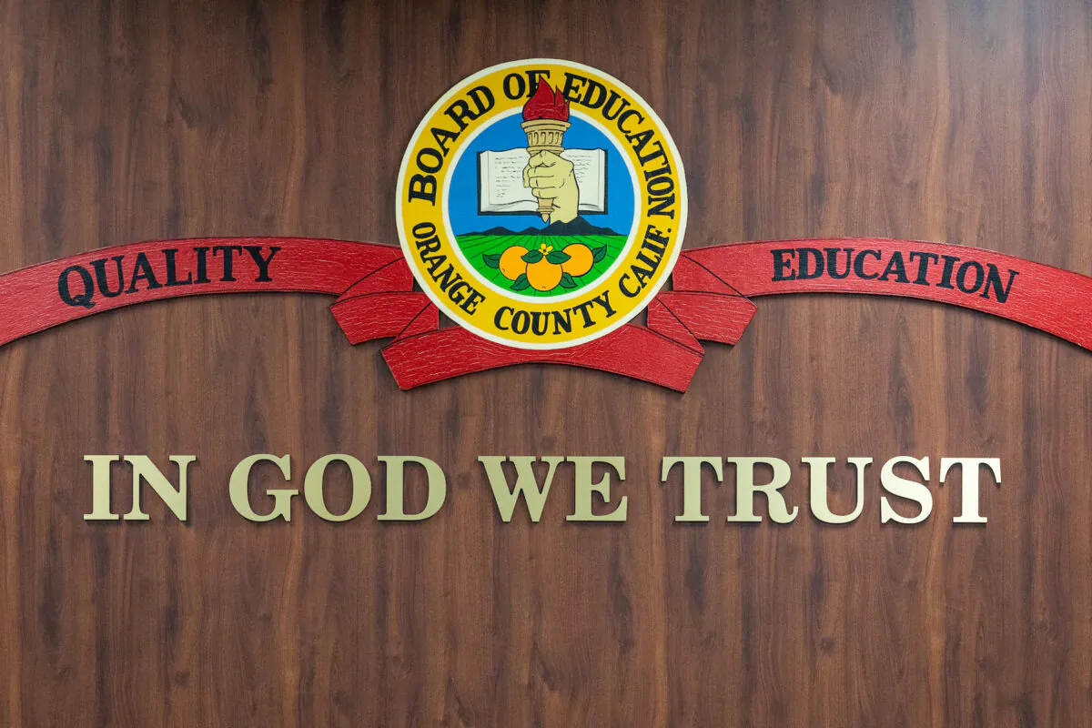 "IN GOD WE TRUST" hangs in the meeting area of the Orange County Board of Education in Costa Mesa, Calif., on Oct. 7, 2020. (John Fredricks/The Epoch Times)
