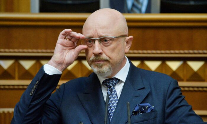 Ukraine's Deputy Prime Minister Oleksi Reznikov will adjust his eyeglasses during a parliamentary session in Kiev, Ukraine on November 4, 2021.  (Olexii Klimenko / Reuters)