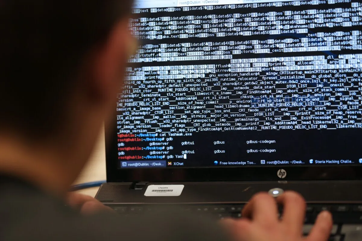 An engineering student takes part in a hacking challenge near Paris on March 16, 2013. (Thomas Samson/AFP via Getty Images)